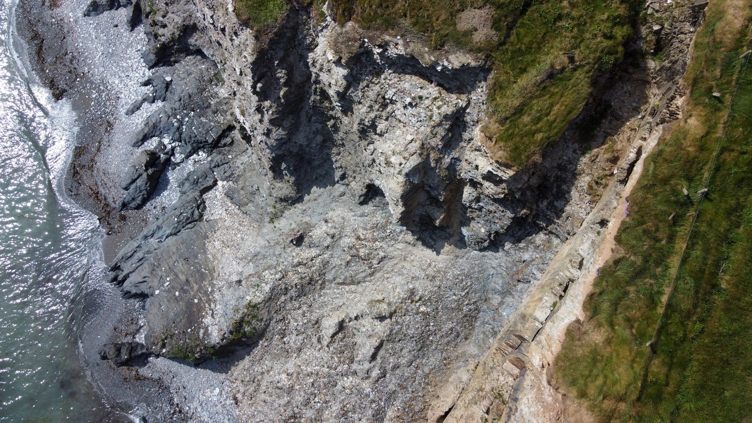 Aerial rocky coastline suggesting large-scale geological structure