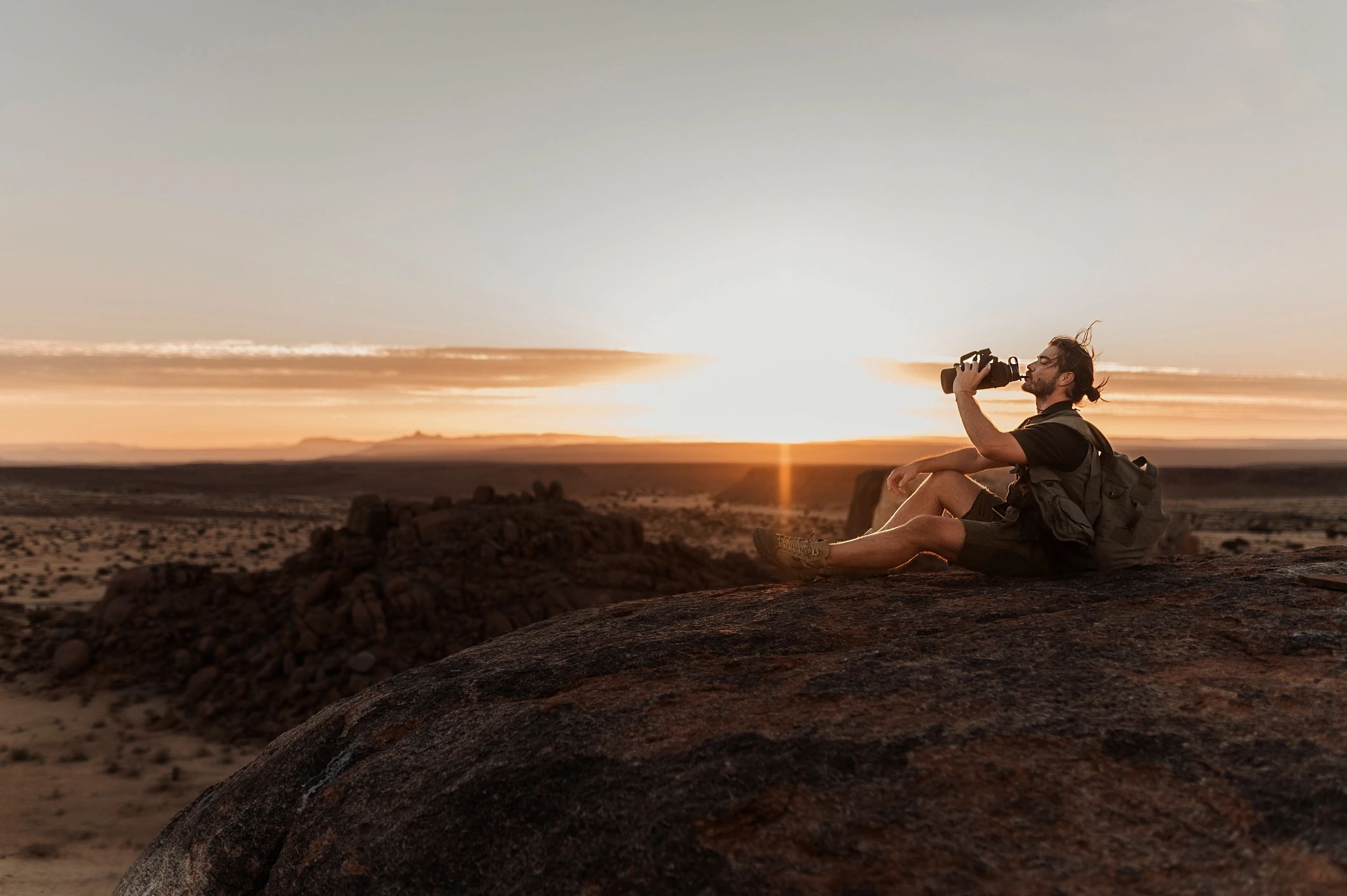Geologist conducting fieldwork on rocky terrain